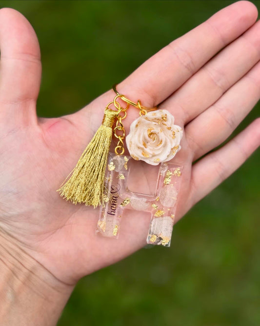 pink petals + gold flakes letter keychain 🌸